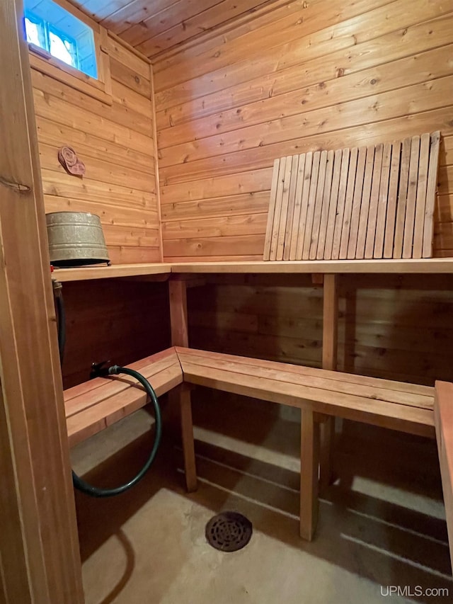 6856 Five Mile Point Rd, Allouez, MI 49805 - sauna with wooden walls and concrete flooring