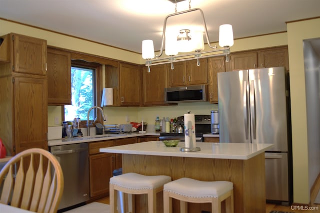 1001 Spruce St, Houghton, MI 49931 - kitchen featuring stainless steel appliances, light countertops, and brown cabinetry