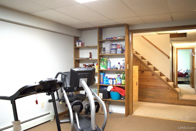 1001 Spruce St, Houghton, MI 49931 - exercise area with a baseboard radiator, carpet flooring, and a paneled ceiling