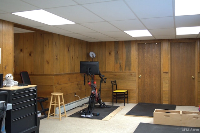 1001 Spruce St, Houghton, MI 49931 - workout room with carpet floors, wood walls, and baseboard heating