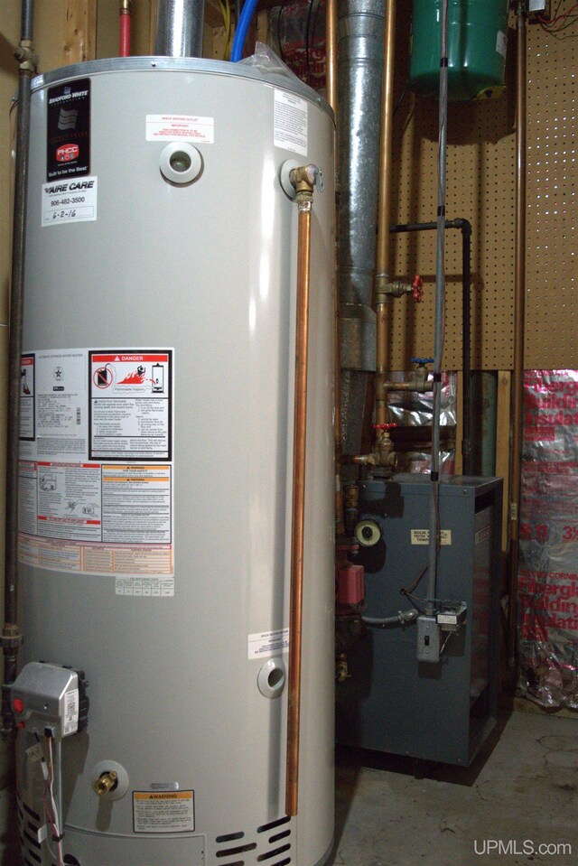 1001 Spruce St, Houghton, MI 49931 - utility room with water heater