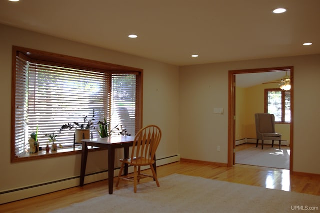 1001 Spruce St, Houghton, MI 49931 - office featuring a baseboard radiator, wood finished floors, recessed lighting, baseboard heating, and baseboards