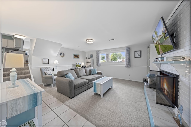 8878 Arlington Rd, White Lake, MI 48386 - living area with light tile patterned floors, a fireplace, and baseboards