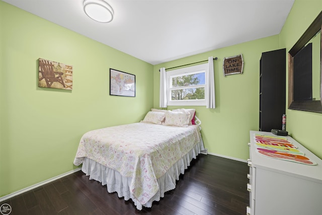 8878 Arlington Rd, White Lake, MI 48386 - bedroom with dark wood-style flooring and baseboards