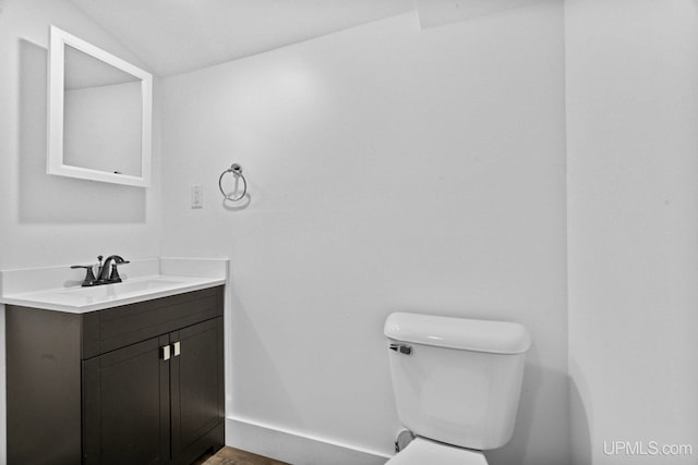 49058 Douglas St, Hancock, MI 49930 - bathroom featuring toilet, vanity, and baseboards