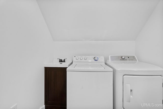 49058 Douglas St, Hancock, MI 49930 - washroom with cabinet space and washer and clothes dryer