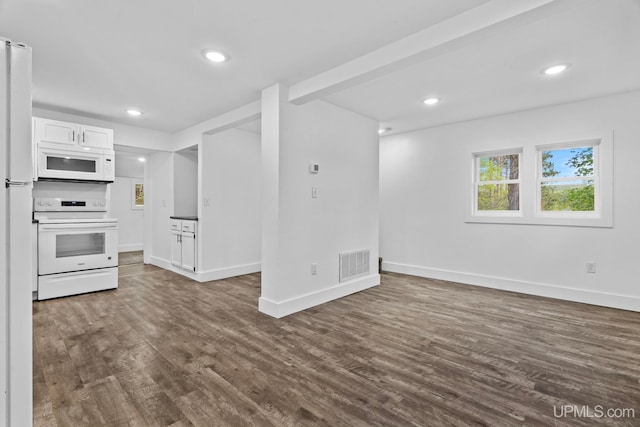 49058 Douglas St, Hancock, MI 49930 - unfurnished living room with dark wood finished floors, baseboards, and recessed lighting