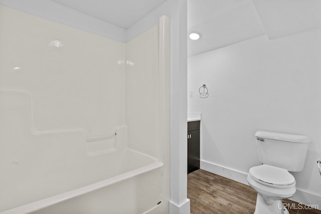 49058 Douglas St, Hancock, MI 49930 - bathroom featuring toilet, wood finished floors, vanity,  shower combination, and baseboards