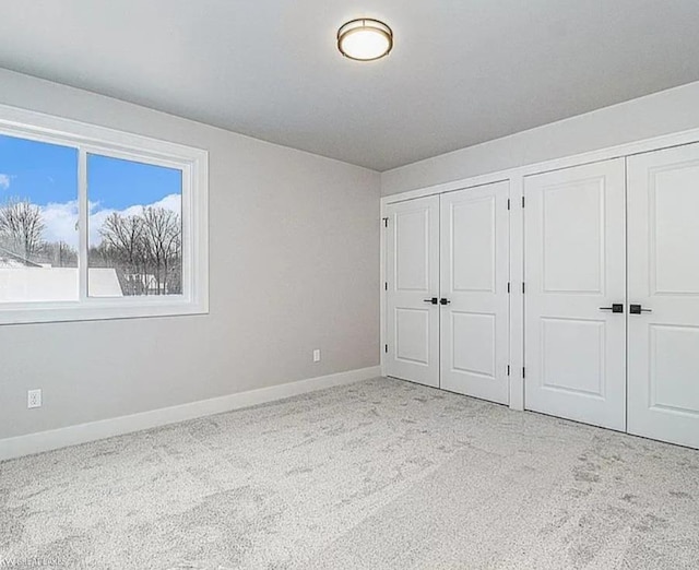 29126 Brooke Meadows Ct, Chesterfield, MI 48047 - unfurnished bedroom with multiple closets, carpet floors, and baseboards
