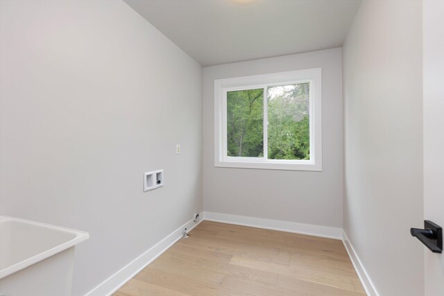 29126 Brooke Meadows Ct, Chesterfield, MI 48047 - laundry room with washer hookup, light wood-style floors, and baseboards