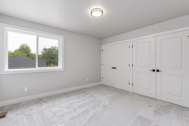 29126 Brooke Meadows Ct, Chesterfield, MI 48047 - unfurnished bedroom featuring two closets, carpet, and baseboards