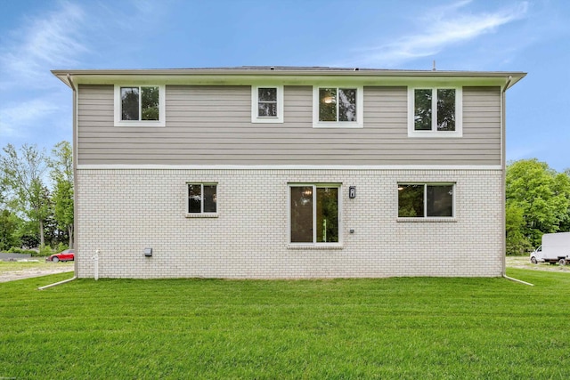 29126 Brooke Meadows Ct, Chesterfield, MI 48047 - rear view of house featuring a lawn and brick siding