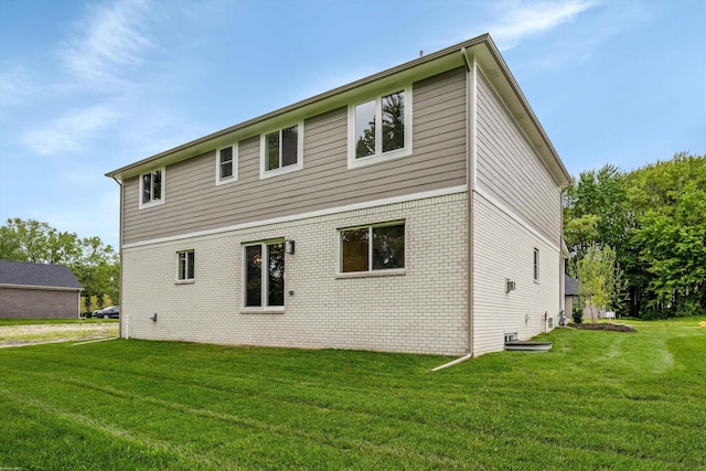 29126 Brooke Meadows Ct, Chesterfield, MI 48047 - rear view of house with a yard and brick siding