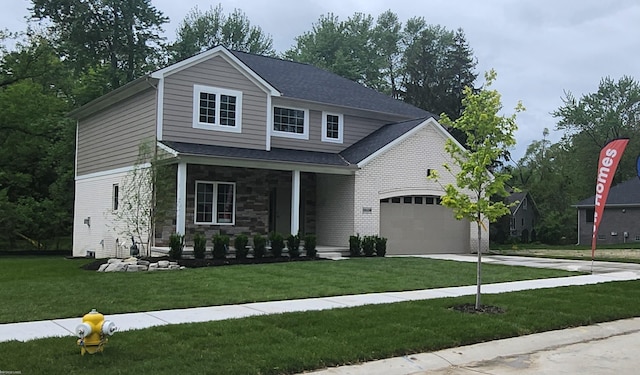 29126 Brooke Meadows Ct, Chesterfield, MI 48047 - view of front of home with a front lawn, driveway, an attached garage, covered porch, and stone siding