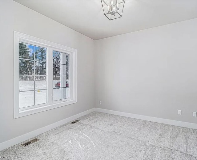 29126 Brooke Meadows Ct, Chesterfield, MI 48047 - empty room featuring baseboards, carpet floors, and a chandelier