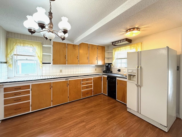 265 Lagoon Beach Dr, Bay City, MI 48706 - kitchen featuring white fridge with ice dispenser, open shelves, dishwasher, a textured ceiling, and a chandelier