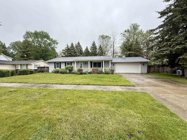 2222 Compton St, Saginaw, MI 48602 - ranch-style house featuring an attached garage, concrete driveway, and a porch