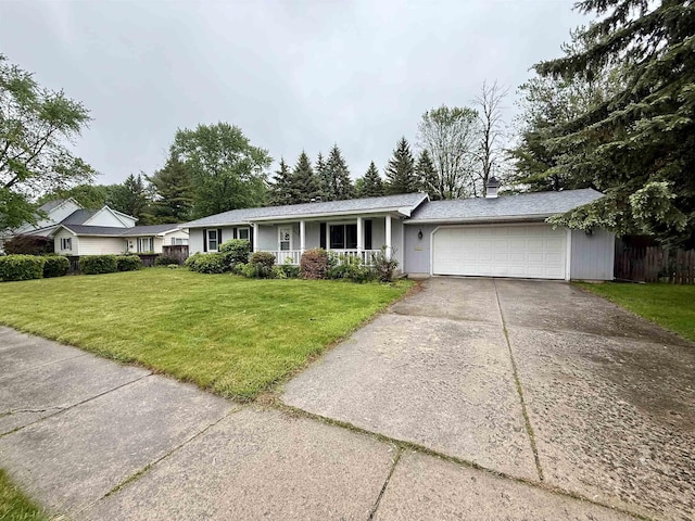 2222 Compton St, Saginaw, MI 48602 - single story home featuring an attached garage, concrete driveway, covered porch, and a chimney