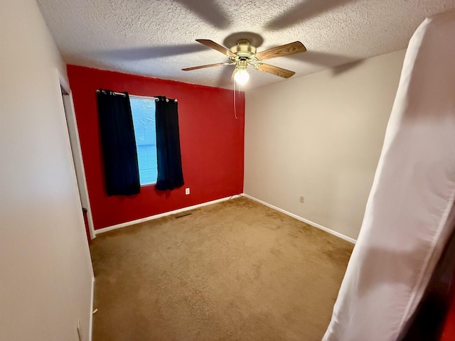 2222 Compton St, Saginaw, MI 48602 - spare room featuring ceiling fan, carpet floors, baseboards, and a textured ceiling