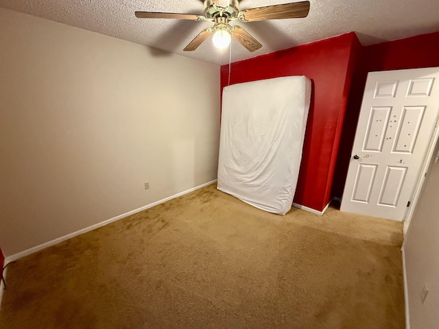 2222 Compton St, Saginaw, MI 48602 - unfurnished bedroom with carpet, a textured ceiling, baseboards, and a ceiling fan