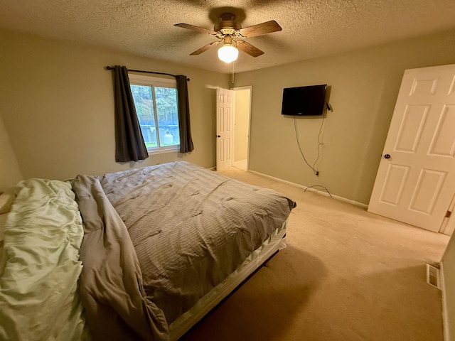2222 Compton St, Saginaw, MI 48602 - bedroom with light colored carpet, a textured ceiling, ceiling fan, and baseboards