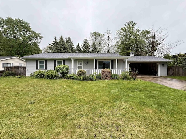 2222 Compton St, Saginaw, MI 48602 - ranch-style house featuring covered porch, an attached garage, and driveway