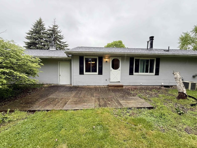 2222 Compton St, Saginaw, MI 48602 - back of property featuring a deck, a lawn, and cooling unit