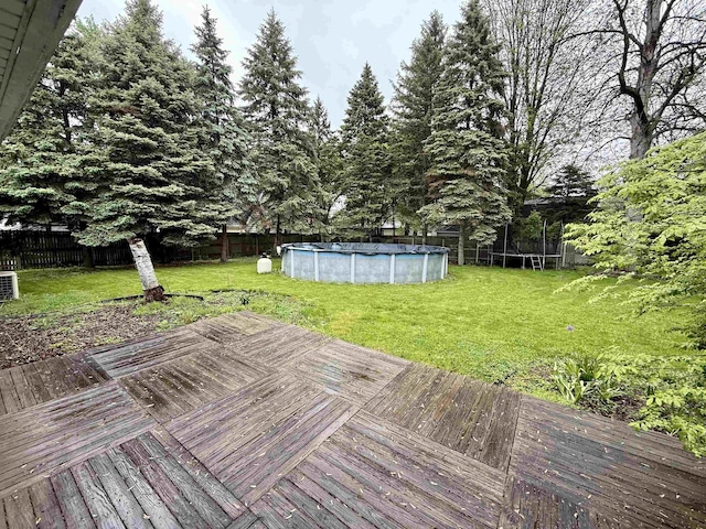 2222 Compton St, Saginaw, MI 48602 - deck with a trampoline