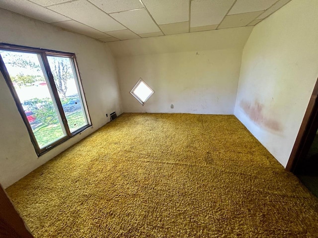 4992 Freeman Rd, Beaverton, MI 48612 - carpeted empty room featuring plenty of natural light and a paneled ceiling