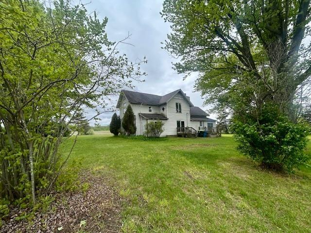 4992 Freeman Rd, Beaverton, MI 48612 - view of property exterior featuring a lawn