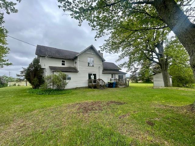 4992 Freeman Rd, Beaverton, MI 48612 - rear view of house with a lawn