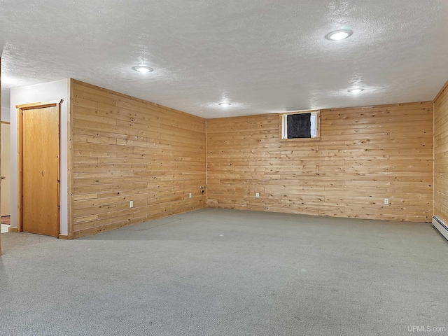 7730 Tipperary Ave, Gladstone, MI 49837 - finished below grade area featuring wood walls, a textured ceiling, recessed lighting, and carpet flooring