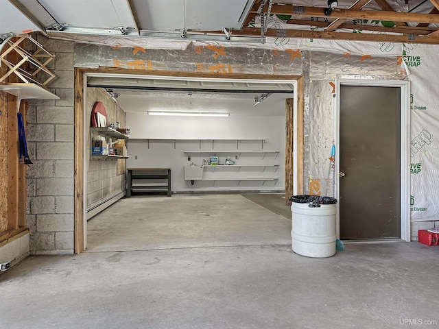 7730 Tipperary Ave, Gladstone, MI 49837 - garage featuring baseboard heating
