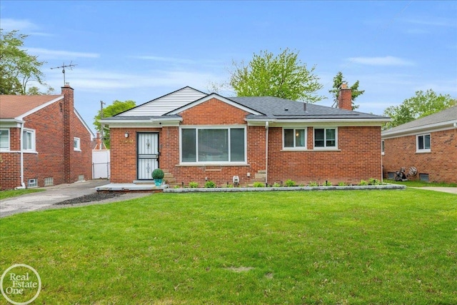 24080 Scotia Rd, Oak Park, MI 48237 - bungalow with brick siding, a front lawn, and a chimney