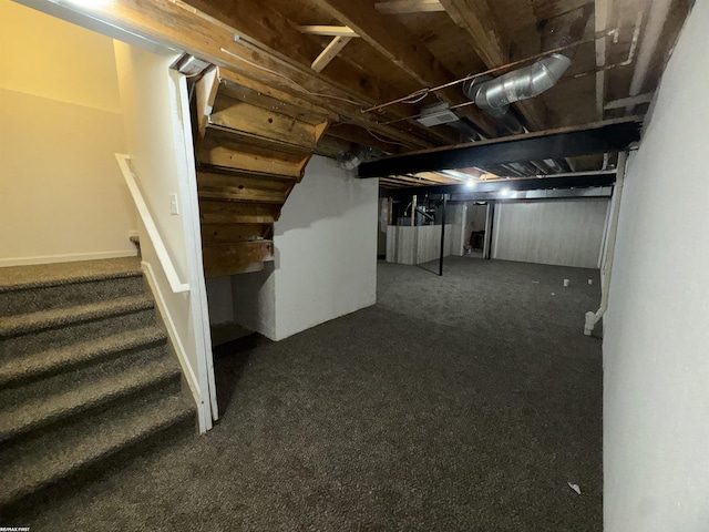 16180 Scenic Dr, Clinton, MI 48038 - below grade area featuring stairway and dark carpet
