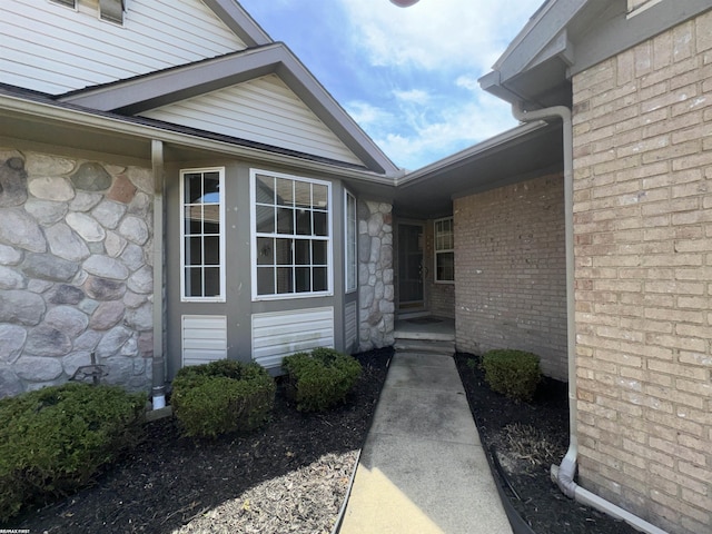 16180 Scenic Dr, Clinton, MI 48038 - property entrance featuring stone siding