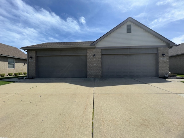 16180 Scenic Dr, Clinton, MI 48038 - ranch-style home featuring brick siding, driveway, and a garage