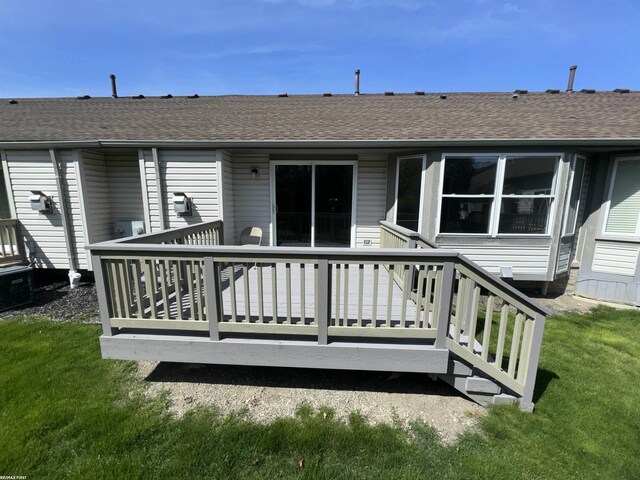 16180 Scenic Dr, Clinton, MI 48038 - back of property with a shingled roof, a yard, and a deck