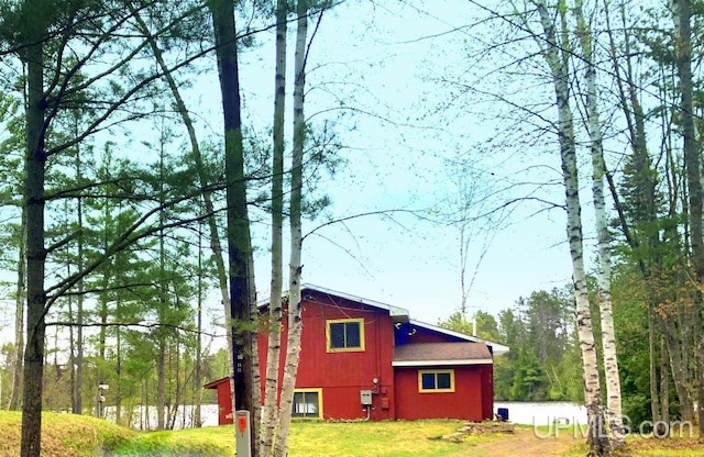 510 S Mackinac Ln, Gwinn, MI 49841 - view of home's exterior with a lawn and a barn
