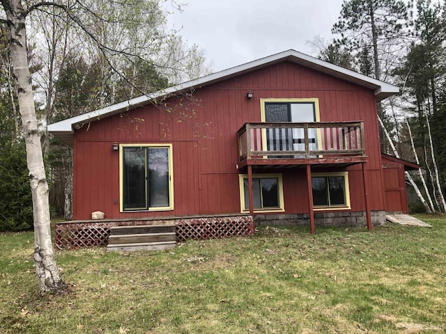 510 S Mackinac Ln, Gwinn, MI 49841 - rear view of property featuring a yard and a balcony