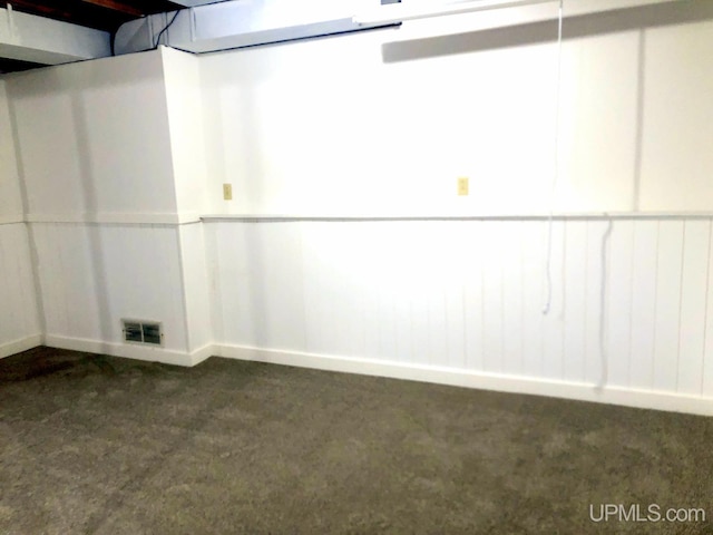 510 S Mackinac Ln, Gwinn, MI 49841 - below grade area with dark colored carpet and baseboards