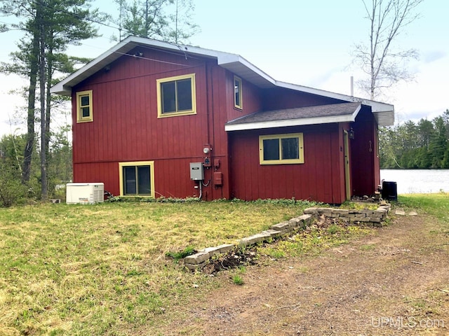 510 S Mackinac Ln, Gwinn, MI 49841 - view of side of home with a lawn