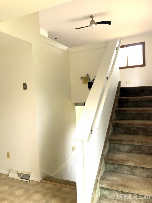 510 S Mackinac Ln, Gwinn, MI 49841 - stairway with ceiling fan and baseboards