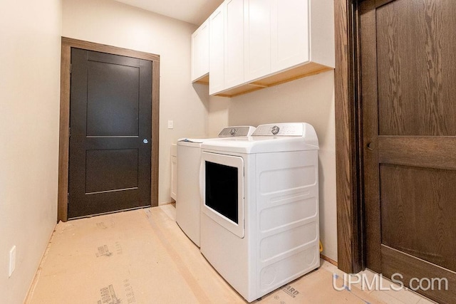 1026 Red Oak Ln, Houghton, MI 49931 - laundry area with cabinet space and separate washer and dryer