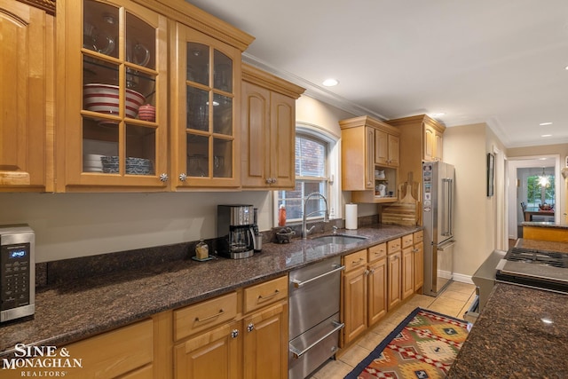 255 Lewiston Rd, Grosse Pointe Farms, MI 48236 - kitchen with appliances with stainless steel finishes, crown molding, light tile patterned floors, glass insert cabinets, and dark stone countertops