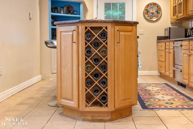 255 Lewiston Rd, Grosse Pointe Farms, MI 48236 - wine area featuring light tile patterned flooring and baseboards