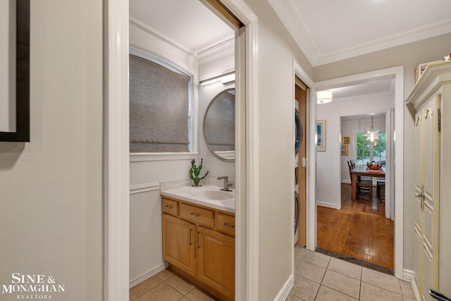 255 Lewiston Rd, Grosse Pointe Farms, MI 48236 - bathroom featuring tile patterned floors, crown molding, and vanity