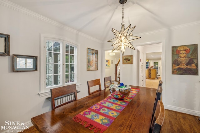 255 Lewiston Rd, Grosse Pointe Farms, MI 48236 - dining space with a chandelier, crown molding, dark wood-style floors, and baseboards
