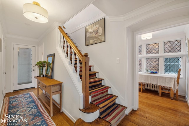 255 Lewiston Rd, Grosse Pointe Farms, MI 48236 - entrance foyer with light wood-style floors, crown molding, baseboards, and stairs