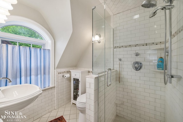 255 Lewiston Rd, Grosse Pointe Farms, MI 48236 - full bathroom with tile patterned flooring, toilet, tile walls, a shower stall, and a sink